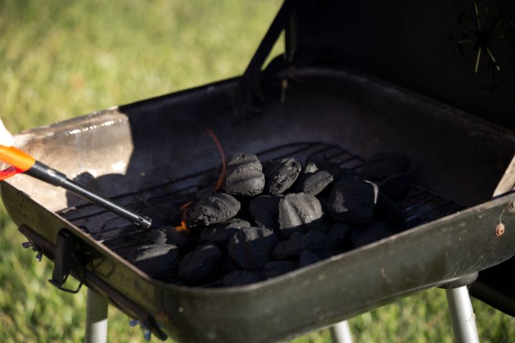 can you use gas to start a charcoal grill