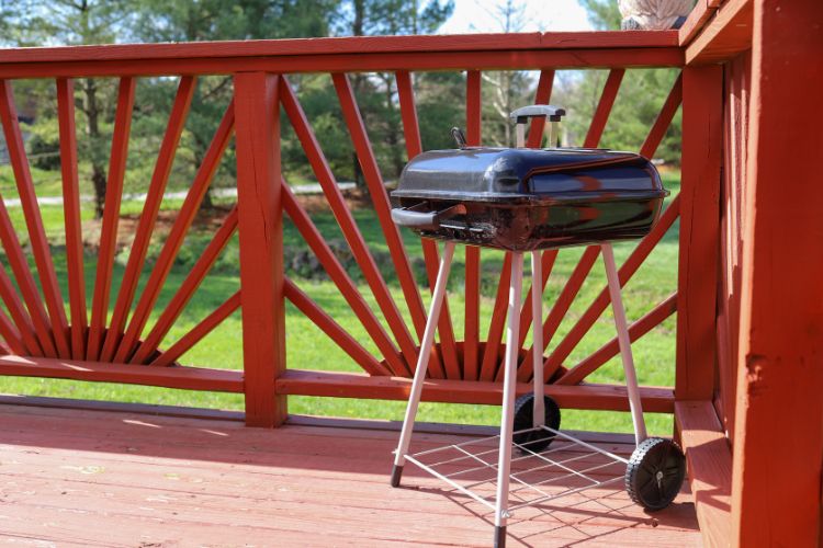 charcoal grill under covered patio